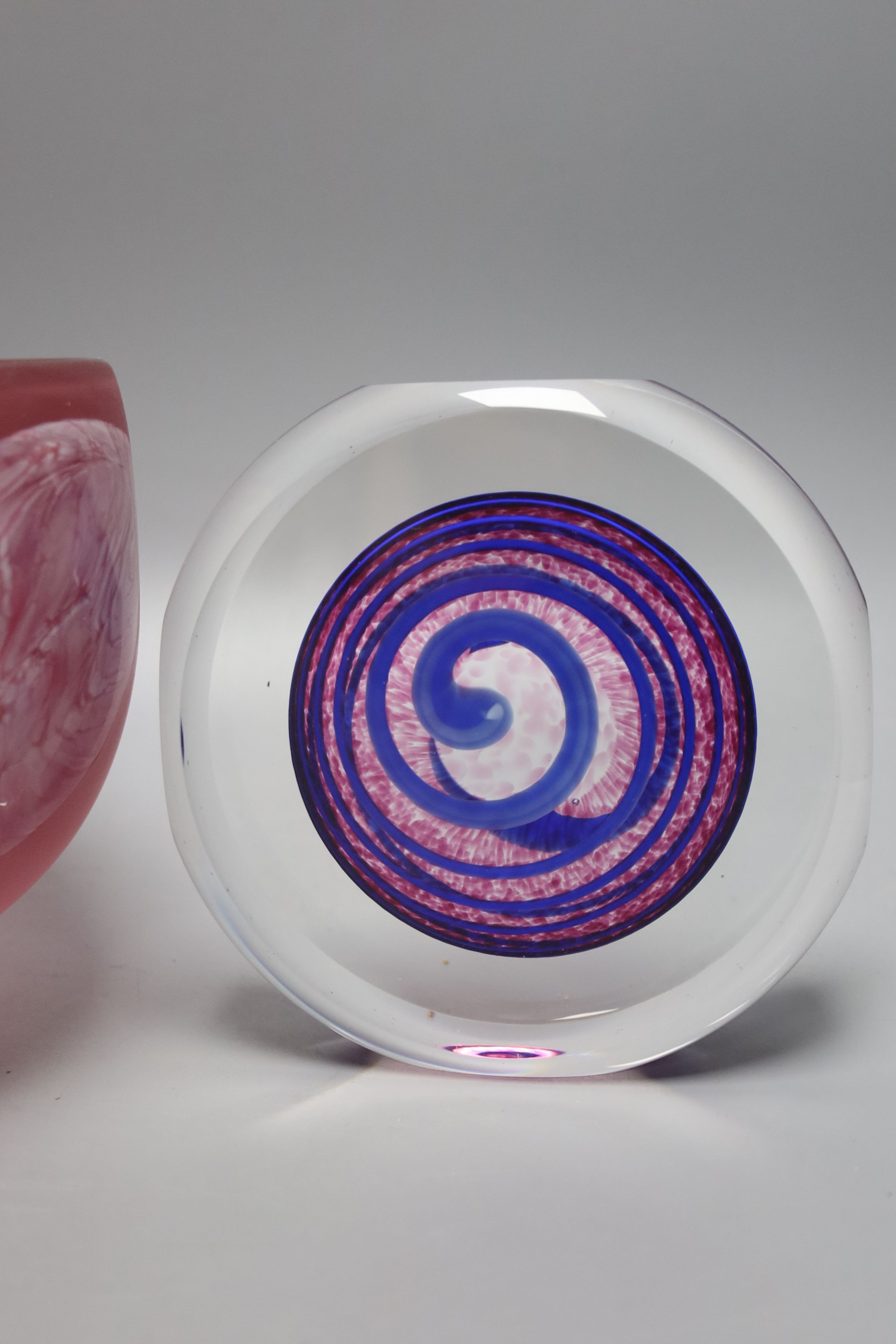 Two Jane Charles art glass disc panels and a pink art glass bowl, tallest 15.5cm